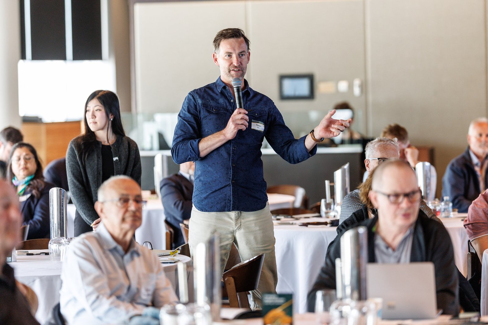 Investors engaging with presenters during Q&A