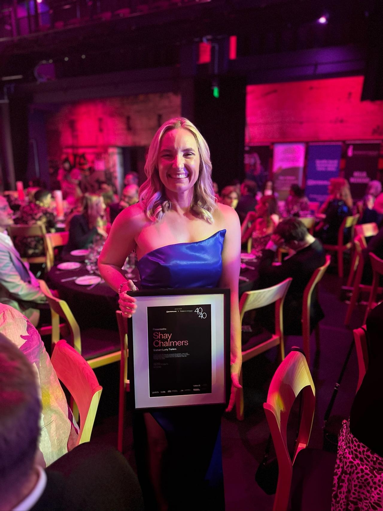 Shay Chalmers receiving her reward
